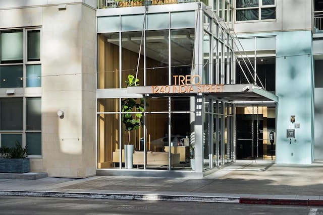 property entrance featuring concrete block siding