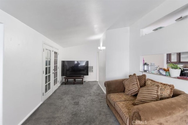 carpeted living area featuring visible vents and baseboards