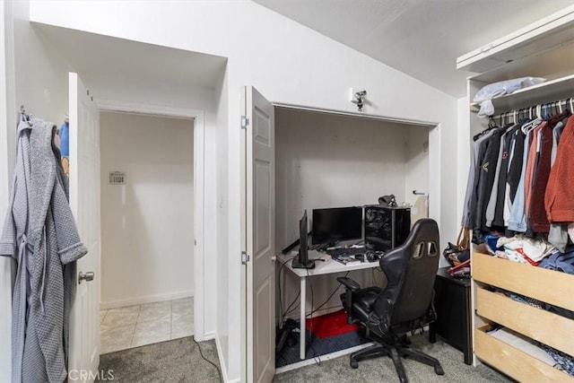 office with carpet floors, tile patterned flooring, and baseboards
