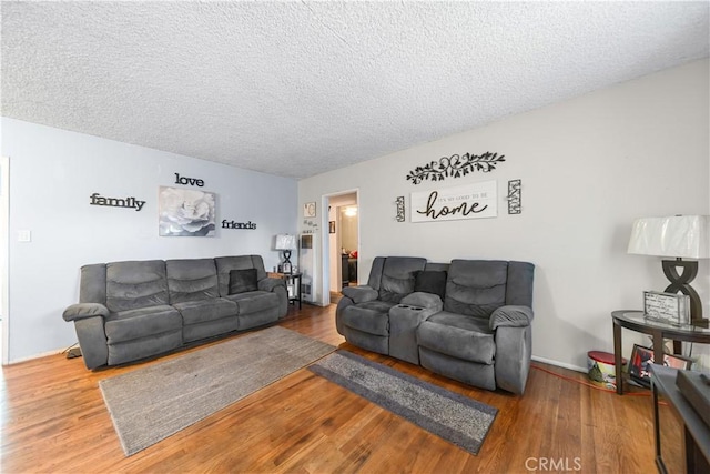 8824 Watson Ave, Whittier, CA 90605 - living room featuring a textured ceiling and wood finished floors