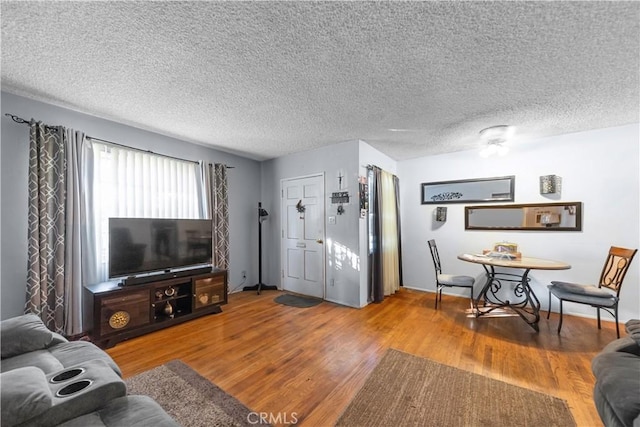 8824 Watson Ave, Whittier, CA 90605 - living room with wood finished floors and a textured ceiling