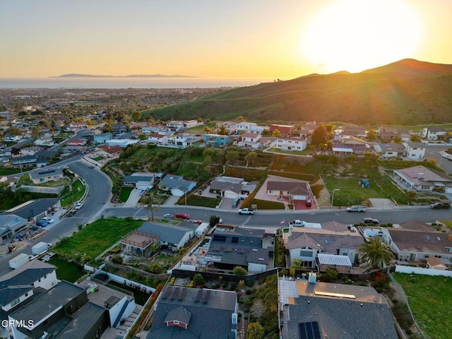 drone / aerial view featuring a mountain view and a residential view
