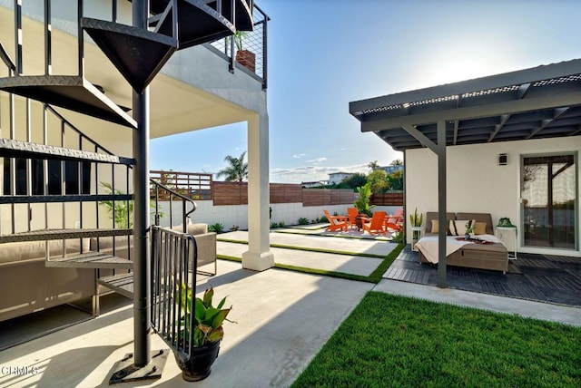 view of patio featuring fence