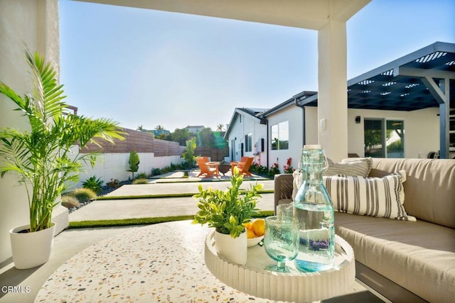 exterior space with a patio area, an outdoor hangout area, and a pergola