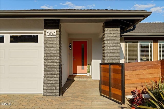 property entrance with a garage