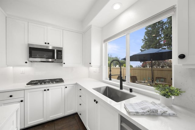6356 Camino Largo, San Diego, CA 92120 - kitchen with appliances with stainless steel finishes, a sink, white cabinets, light countertops, and recessed lighting