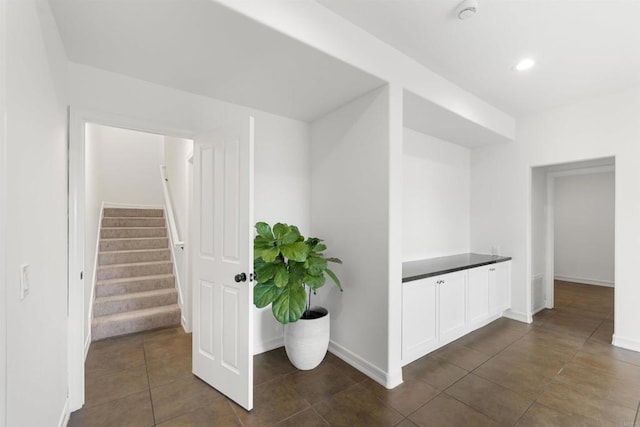 6356 Camino Largo, San Diego, CA 92120 - corridor featuring dark tile patterned flooring, stairs, baseboards, and recessed lighting