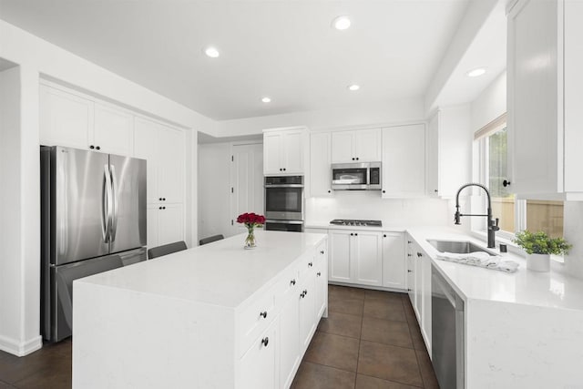 6356 Camino Largo, San Diego, CA 92120 - kitchen featuring appliances with stainless steel finishes, a sink, recessed lighting, a center island, and white cabinets