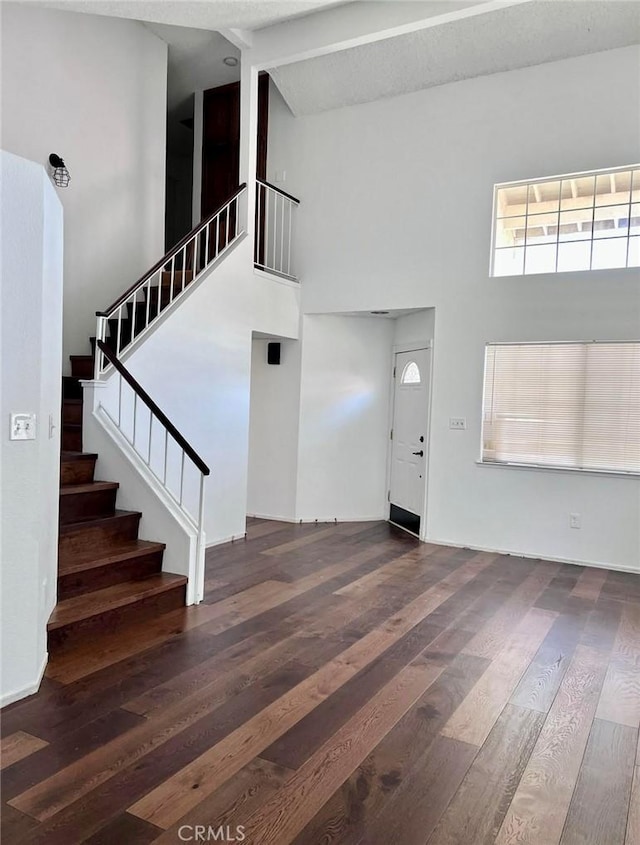 8109 Birch St, Bakersfield, CA 93311 - foyer featuring wood finished floors, a towering ceiling, and stairs