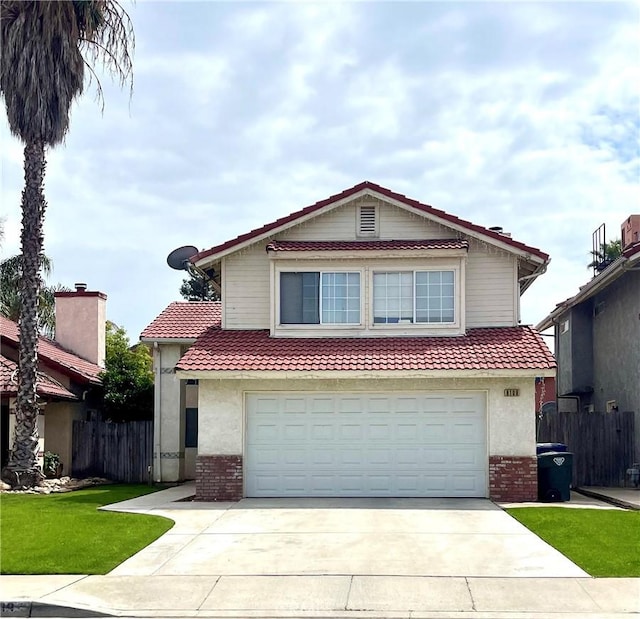 8109 Birch St, Bakersfield, CA 93311 - view of front of property featuring fence, an attached garage, a tile roof, driveway, and brick siding
