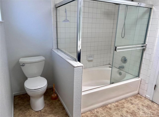 8109 Birch St, Bakersfield, CA 93311 - full bath featuring tile patterned floors, baseboards, enclosed tub / shower combo, and toilet