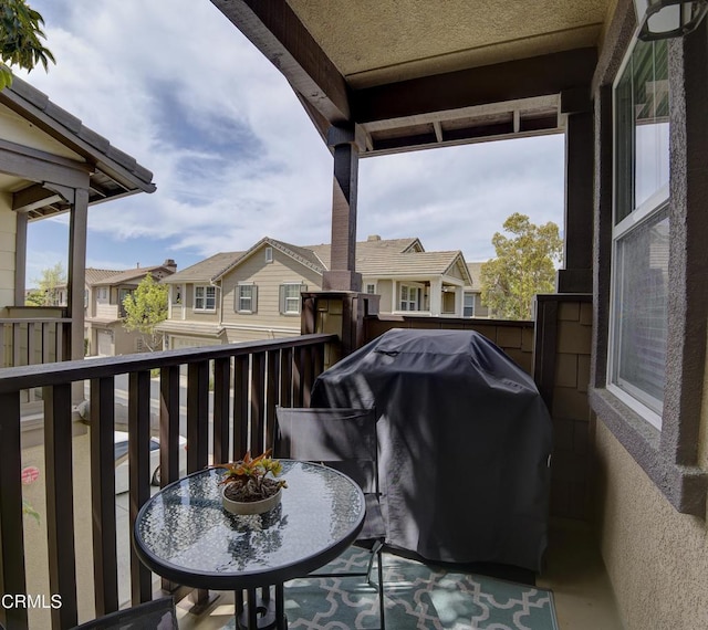 balcony with a residential view and area for grilling