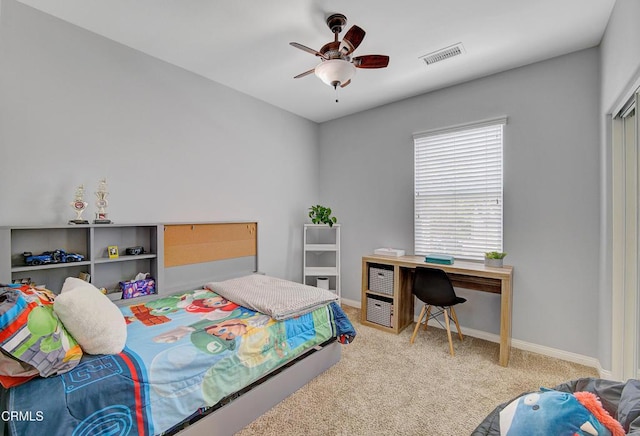 bedroom with baseboards, visible vents, carpet floors, and ceiling fan