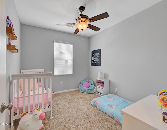 carpeted bedroom with baseboards and ceiling fan