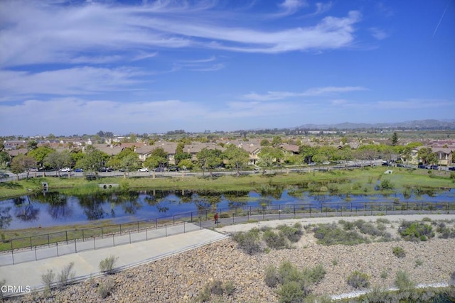 water view featuring fence and a residential view