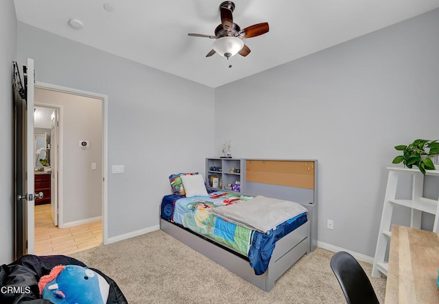 bedroom featuring carpet floors, baseboards, and ceiling fan