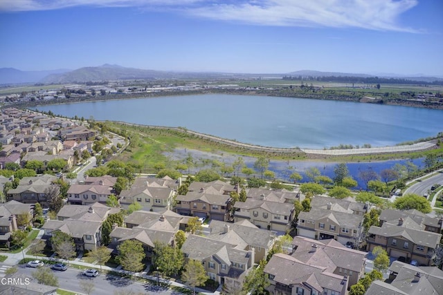 aerial view with a residential view and a water and mountain view