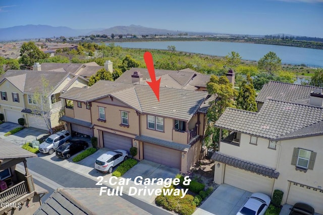 aerial view with a water view and a residential view