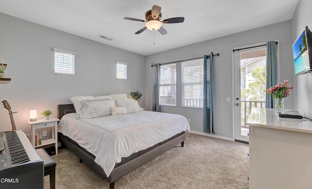 bedroom with ceiling fan, light colored carpet, baseboards, access to outside, and visible vents