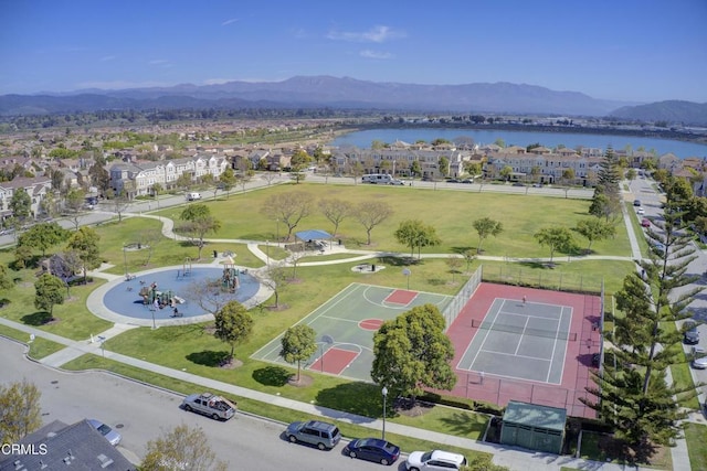 drone / aerial view with a water and mountain view