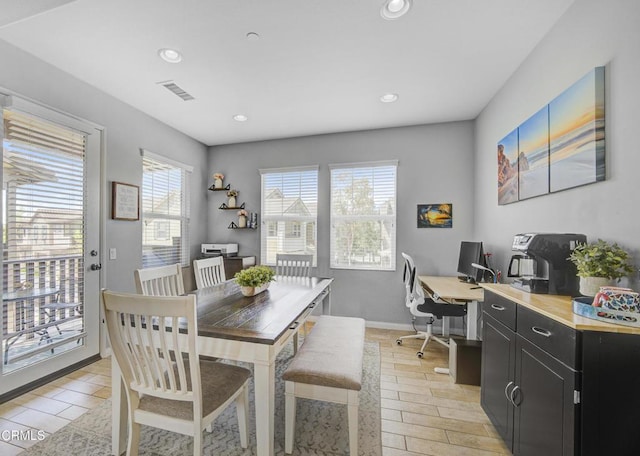 dining room featuring light wood finished floors, visible vents, a wealth of natural light, and recessed lighting