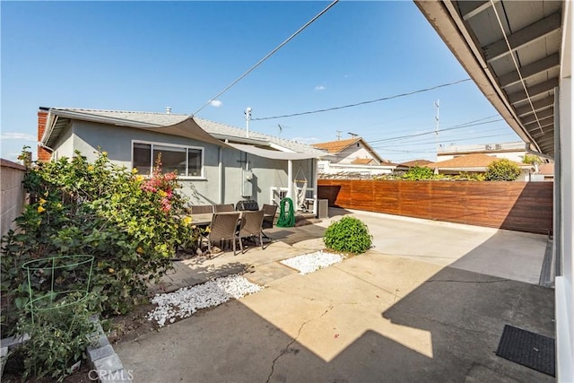 view of patio featuring outdoor dining space and a fenced backyard