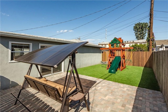view of patio featuring a fenced backyard and a playground