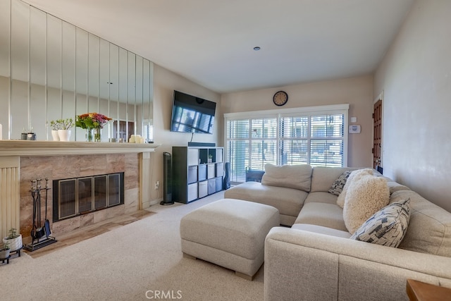 living area with a premium fireplace and carpet flooring