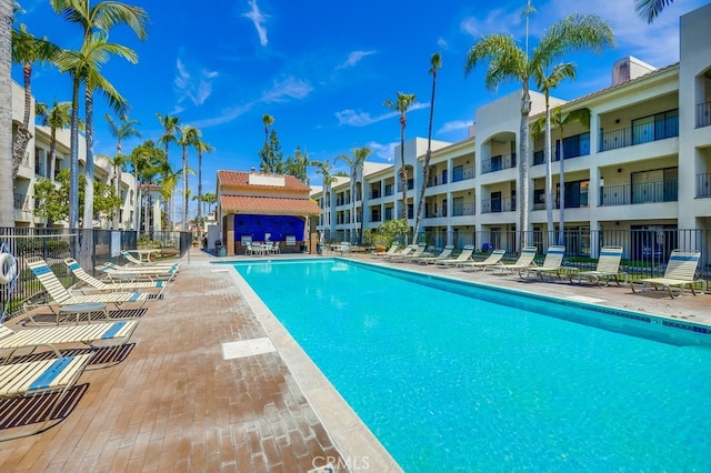 pool featuring a patio and fence