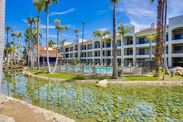 view of water feature featuring fence