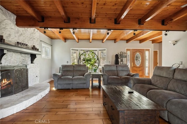 24540 Horst Dr, Crestline, CA 92325 - living area with light wood-type flooring, rail lighting, wood ceiling, and beam ceiling