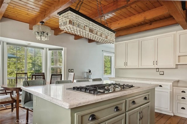 24540 Horst Dr, Crestline, CA 92325 - kitchen featuring stainless steel gas stovetop, a wooden ceiling with exposed beams, a chandelier, light stone counters, and wood finished floors