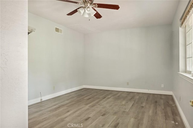 24540 Horst Dr, Crestline, CA 92325 - spare room with wood finished floors and a ceiling fan