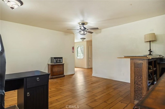 24540 Horst Dr, Crestline, CA 92325 - unfurnished living room featuring wood finished floors and ceiling fan