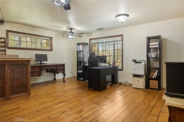 24540 Horst Dr, Crestline, CA 92325 - office with light wood-style flooring and ceiling fan