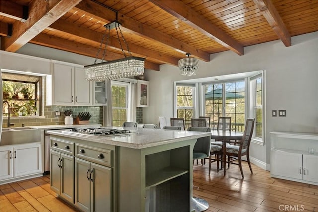 24540 Horst Dr, Crestline, CA 92325 - kitchen with stainless steel gas cooktop, decorative backsplash, wood ceiling, and light wood-type flooring