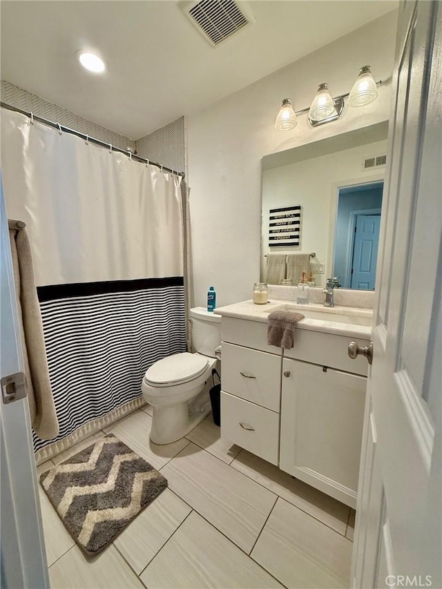 28236 Branch Rd, Castaic, CA 91384 - bathroom featuring visible vents, tile patterned flooring, toilet, and vanity