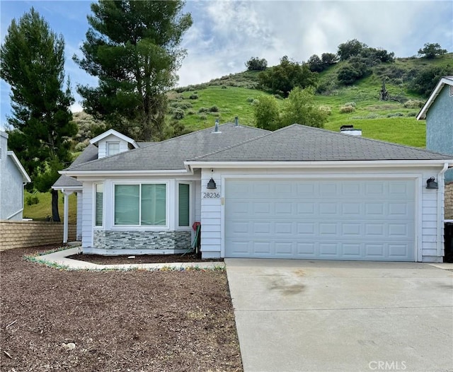 28236 Branch Rd, Castaic, CA 91384 - single story home with a garage, driveway, and stone siding