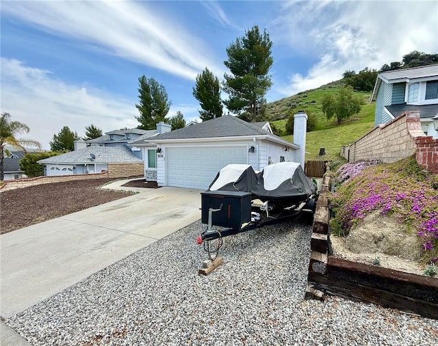 28236 Branch Rd, Castaic, CA 91384 - view of side of property featuring a garage, fence, a chimney, and concrete driveway