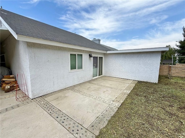28236 Branch Rd, Castaic, CA 91384 - back of property with a patio, stucco siding, and fence