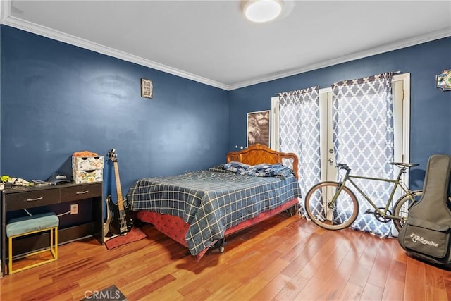1435 W 50th St, Los Angeles, CA 90062 - bedroom with wood finished floors and crown molding
