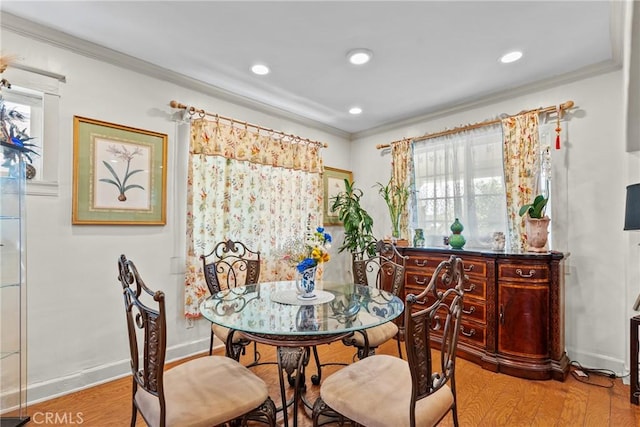1435 W 50th St, Los Angeles, CA 90062 - dining space with crown molding, wood finished floors, plenty of natural light, and recessed lighting