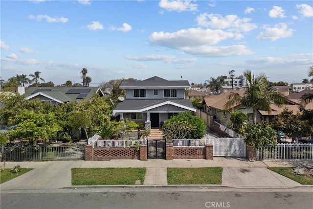 1435 W 50th St, Los Angeles, CA 90062 - view of front facade with a gate, a fenced front yard, a porch, and a residential view