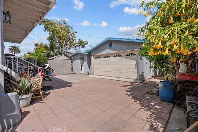1435 W 50th St, Los Angeles, CA 90062 - detached garage featuring a storage shed