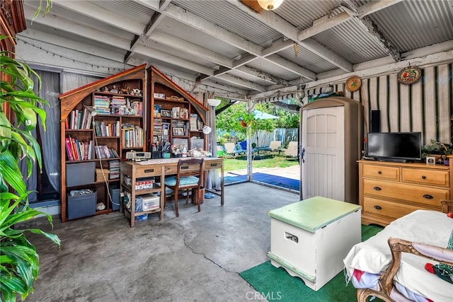 garage with a trampoline and a shed