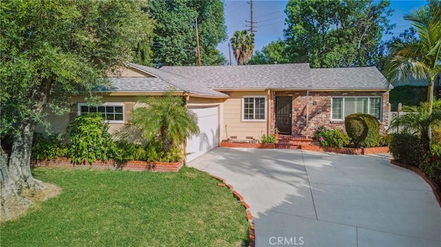 single story home with a front lawn, a shingled roof, driveway, brick siding, and an attached garage
