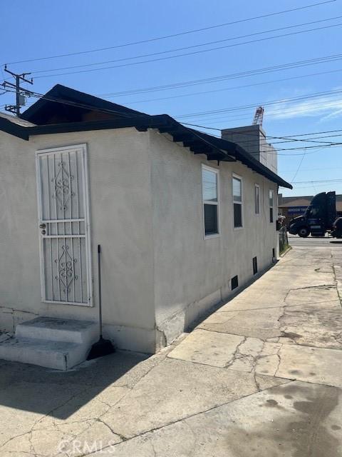 view of home's exterior featuring entry steps and stucco siding