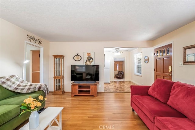 16230 Denley St, Hacienda Heights, CA 91745 - living area featuring light wood-style flooring, a textured ceiling, and ceiling fan