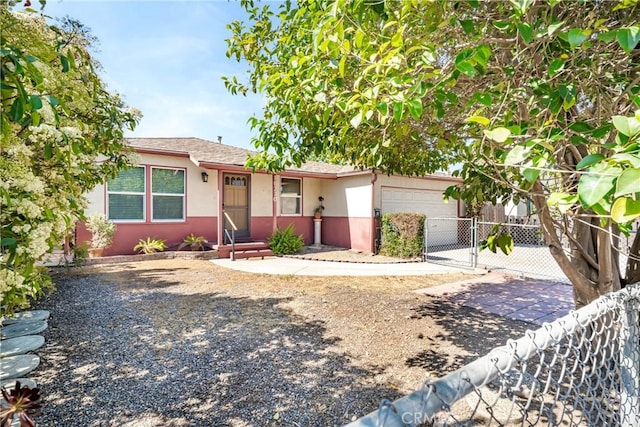ranch-style house with concrete driveway, stucco siding, a gate, entry steps, and fence
