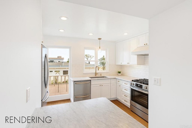 145 13th St, Del Mar, CA 92014 - kitchen featuring appliances with stainless steel finishes, a sink, under cabinet range hood, white cabinets, and recessed lighting